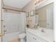 Well-lit bathroom featuring a shower and bathtub combo, vanity, and decorative accents at 503 20Th Ave. N # 15B, North Myrtle Beach, SC 29582