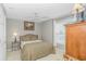 Cozy bedroom with ceiling fan, window, bedside lamp, and wood dresser at 503 20Th Ave. N # 15B, North Myrtle Beach, SC 29582