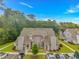 Exterior view of the grey two-story townhome with manicured landscaping and parking at 503 20Th Ave. N # 15B, North Myrtle Beach, SC 29582