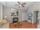 Cozy living room featuring a fireplace, hardwood floors, neutral walls, and a seamless transition to the staircase at 503 20Th Ave. N # 15B, North Myrtle Beach, SC 29582
