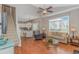 Inviting living room with hardwood floors, ceiling fan, and a seamless transition to the dining area at 503 20Th Ave. N # 15B, North Myrtle Beach, SC 29582