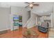 Bright living room boasting hardwood floors, a ceiling fan, and seamless flow into the dining area and staircase at 503 20Th Ave. N # 15B, North Myrtle Beach, SC 29582