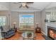 Comfortable living room with a decorative fireplace, plush seating, and bright natural light from a large window at 503 20Th Ave. N # 15B, North Myrtle Beach, SC 29582