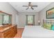Comfortable main bedroom featuring wood floors, a ceiling fan, and natural light from the window at 503 20Th Ave. N # 15B, North Myrtle Beach, SC 29582