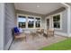 Relaxing covered patio with outdoor seating, offering a tranquil space for relaxation and entertaining at 5039 Selene Ct., Myrtle Beach, SC 29588