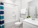 Clean bathroom includes a tub and shower combo, white vanity, and ceramic tile flooring at 5039 Selene Ct., Myrtle Beach, SC 29588