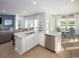Kitchen featuring stainless dishwasher, granite countertops, open to living and dining rooms at 5039 Selene Ct., Myrtle Beach, SC 29588