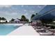 Inviting community pool with sunshades and lounge chairs, surrounded by lush landscaping and a modern clubhouse at 5039 Selene Ct., Myrtle Beach, SC 29588