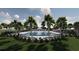 Resort-style community pool and lounging area with palm trees and covered seating provides a relaxing retreat at 5039 Selene Ct., Myrtle Beach, SC 29588
