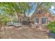 Expansive wooden deck with outdoor seating and a built-in bar, surrounded by lush trees at 510 Rum Gully Rd., Murrells Inlet, SC 29576
