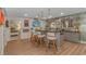 Finished basement with custom bar, granite counters, tv, seating, and luxury vinyl plank flooring at 510 Rum Gully Rd., Murrells Inlet, SC 29576