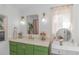 Bright bathroom with a vanity, gold accents, and floral decorations at 510 Rum Gully Rd., Murrells Inlet, SC 29576