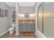 Nautical themed powder room features wood floors, custom vanity with lots of drawers, and modern lighting at 510 Rum Gully Rd., Murrells Inlet, SC 29576