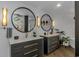 Elegant bathroom with dual vanities, round mirrors, and contemporary light fixtures at 510 Rum Gully Rd., Murrells Inlet, SC 29576