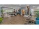 Open concept living room with wood flooring, gas fireplace, custom staircase, and upscale furniture at 510 Rum Gully Rd., Murrells Inlet, SC 29576