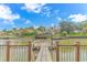 Dock view showcases waterfront home with boat dock, gazebo, and lush landscaping at 510 Rum Gully Rd., Murrells Inlet, SC 29576