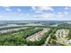 An aerial view of the property's location in a lush, green neighborhood with serene surroundings and beautiful landscaping at 5149 Morning Frost Pl., Myrtle Beach, SC 29579