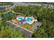 A picturesque view showcases the community amenities, including a pool, playground, barn themed pavilion, and parking at 5149 Morning Frost Pl., Myrtle Beach, SC 29579