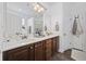 Well-lit bathroom featuring double sinks, modern fixtures, and plenty of counter space at 5149 Morning Frost Pl., Myrtle Beach, SC 29579