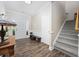 Grand foyer with hardwood floors, staircase, and ample natural light creating an inviting entrance at 5149 Morning Frost Pl., Myrtle Beach, SC 29579
