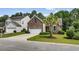 A well-maintained lawn and plantings enhance the curb appeal of this charming brick home at 5149 Morning Frost Pl., Myrtle Beach, SC 29579