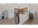 Galley style kitchen featuring stainless steel appliances, dark wood cabinetry, and a breakfast bar at 5149 Morning Frost Pl., Myrtle Beach, SC 29579