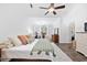 Spacious main bedroom featuring a ceiling fan, desk, and ensuite bathroom at 5149 Morning Frost Pl., Myrtle Beach, SC 29579
