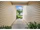 View of the yard and house from the side walkway, showcasing the neat and clean design at 5149 Morning Frost Pl., Myrtle Beach, SC 29579