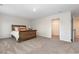 Bedroom with neutral tones, carpet flooring, and a view into the closet at 555 Strawberry Field Way, Galivants Ferry, SC 29544