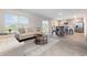Open-concept layout with living, dining, and kitchen areas, flooded with natural light at 555 Strawberry Field Way, Galivants Ferry, SC 29544