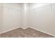 An empty walk-in closet with carpeted floors and wire shelving on the walls for optimal storage at 555 Strawberry Field Way, Galivants Ferry, SC 29544