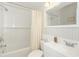 Bright, clean bathroom features a shower/tub combo and vanity with storage at 5601 N Ocean Blvd. # C-314, Myrtle Beach, SC 29577