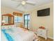 Inviting bedroom with a beach theme, dresser with mirror, and balcony access at 5601 N Ocean Blvd. # C-314, Myrtle Beach, SC 29577