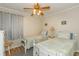 Bright bedroom featuring two twin beds, neutral walls, and a ceiling fan at 5601 N Ocean Blvd. # C-314, Myrtle Beach, SC 29577