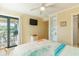 Bedroom featuring access to a balcony, built-in shelving, and a relaxing view at 5601 N Ocean Blvd. # C-314, Myrtle Beach, SC 29577