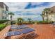 Inviting deck area with lounge chairs overlooking lush landscaping and the ocean at 5601 N Ocean Blvd. # C-314, Myrtle Beach, SC 29577