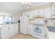 Bright kitchen with white appliances, ample counter space, and seamless access to the living area at 5601 N Ocean Blvd. # C-314, Myrtle Beach, SC 29577