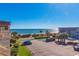 Expansive ocean view overlooking palm trees and parking area, offering a glimpse of coastal living at 5601 N Ocean Blvd. # C-314, Myrtle Beach, SC 29577