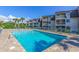 Sparkling community pool surrounded by lush greenery and comfortable lounge seating at 5601 N Ocean Blvd. # C-314, Myrtle Beach, SC 29577