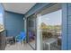 Relaxing balcony featuring outdoor seating, a small table, and serene views through sliding glass doors at 5905 South Kings Hwy. # 132B, Myrtle Beach, SC 29575