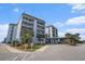 Image of the condominium complex entrance showcasing well maintained landscaping and covered entry at 5905 South Kings Hwy. # 132B, Myrtle Beach, SC 29575