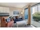 Cozy living room featuring modern furnishings, balcony access, and a relaxing atmosphere at 5905 South Kings Hwy. # 132B, Myrtle Beach, SC 29575