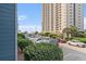Convenient parking area near a tall condo building, showcasing easy access for residents and guests at 5905 South Kings Hwy. # 132B, Myrtle Beach, SC 29575