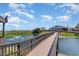 Picturesque boardwalk with tranquil water feature and restaurant offering scenic waterfront views at 5905 South Kings Hwy. # 132B, Myrtle Beach, SC 29575