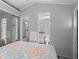 Bedroom with mirror closets, an entrance to the bathroom, and a full-size bed at 6001 -6010 S Kings Highway, Myrtle Beach, SC 29575
