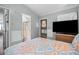 A bedroom featuring a full-size bed, and access to the bathroom at 6001 -6010 S Kings Highway, Myrtle Beach, SC 29575