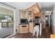 Functional kitchenette with modern appliances, bar seating, and easy access to the outdoor porch, perfect for casual meals at 6001 -6010 S Kings Highway, Myrtle Beach, SC 29575