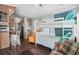 Cozy living room featuring a bunk bed, lounge chair, breakfast bar, and comfortable seating, perfect for relaxing at 6001 -6010 S Kings Highway, Myrtle Beach, SC 29575