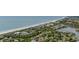 Scenic aerial view showcasing beachfront homes, lush greenery, and ocean views, capturing the essence of coastal living at 601 Retreat Beach Circle # 213, Pawleys Island, SC 29585