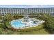 Aerial view of a community pool with umbrellas and water features at 601 Retreat Beach Circle # 213, Pawleys Island, SC 29585